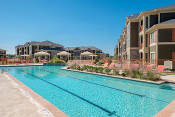 Expansive resort style pool and custom fountain, lounge deck, and cabanas